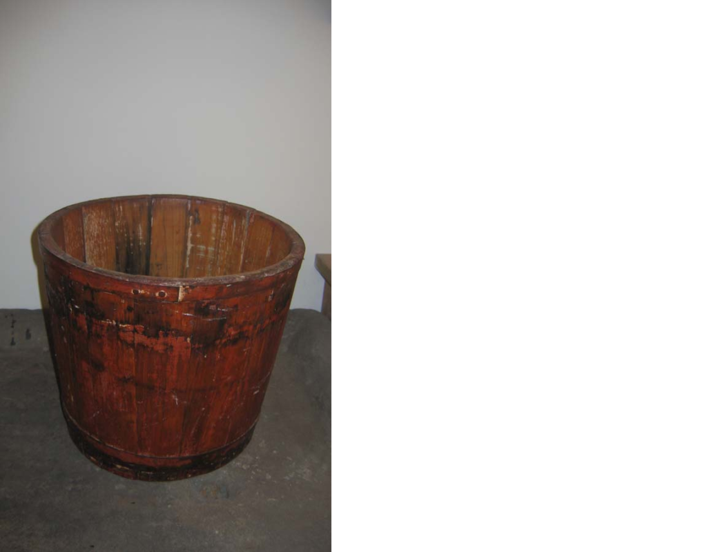 Red painted wooden bucket